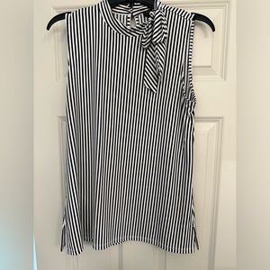 High neck sleeveless blouse, navy blue and white stripe with bow detail on front